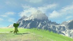 an animated image of a green dinosaur standing in front of a mountain with snow capped peaks