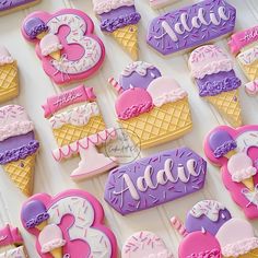 decorated cookies are arranged in the shape of ice cream cones and numbers for birthdays