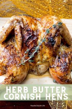 a roasted chicken with herbs on it and the words herb butter cornish hens