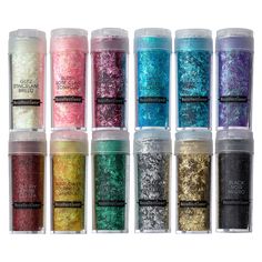 six different colors of glitter in small containers