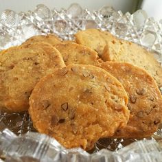 four cookies sitting on top of a glass plate