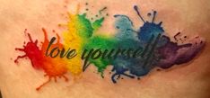 a colorful tattoo with the words love yourself painted on it