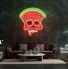 a living room filled with furniture and a neon skull sign on the wall above it