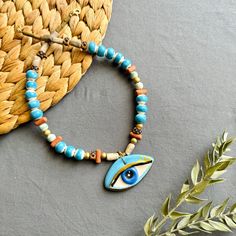 🌟 Designed for those who like to be original and looking for unique jewelry  ✅ Each piece is hand-shaped and drawn by us, making it wonderfully unique--so, expect a bit of delightful variation from the pictures 🍀 Because of their handmade charm, every ceramic piece is entirely one-of-a-kind. These high-quality creations are made to last, just like the memories you'll create with them!  🎁 It is suitable for every day , it can also be purchased as a perfect gift for special days like Valentine's Day, Mother's Day, Christmas or Birthday gift 🧿 Turkish evil eye  The evil eye symbolizes protection from bad energy and envy in Turkish and Middle Eastern culture The evil eye bead is believed to bring good vibes and good luck, we hope it will give you the same feeling! 📦 Packing :  All necklac Ceramic Pendant Necklace, Turkish Evil Eye, Gifts For My Girlfriend, Ceramic Pendant, Handmade Charms, Evil Eye Necklace, Unique Handmade Jewelry, Eye Necklace, Jewelry Pouch