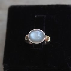 Gemstone - Natural Grey Moonstone Gemstone Size - 9x11 mm oval Metal - Sterling Silver  Ring size - All sizes available  Each Ring made with Precision and love, these rings are perfect for everyday use and a perfect accessory to wear at work.  Rings can be customized on request and gemstone can be switched to any other as per requirement.  Same design also uploaded with Amethyst, Aqua Chalcedony, black star diopside, Citrine, Carnelian, Crystal Quartz, Golden rutile quartz, Lapis Lazuli, Labrado Moonstone Oval Cabochon Crystal Ring Gift, Handmade Moon-shaped Spiritual Crystal Ring, Sterling Silver Cabochon Amethyst Ring Gift, Spiritual Moonstone Cabochon Ring, Moonstone Crystal Ring, Oval Cabochon, Gift, Grey Moonstone, Handmade Jewelry Box, Unisex Gift, Tigers Eye Gemstone