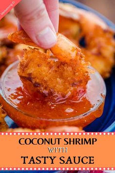 a person dipping some food into a small glass bowl with the words coconut shrimp with tasty sauce on it