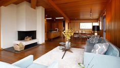 a living room filled with furniture and a fire place