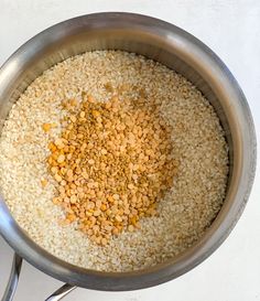 a pan filled with rice and other ingredients