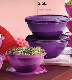 purple bowls are stacked on top of each other