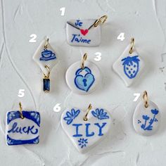 a bunch of charms with names and pictures on them, all in different shapes and sizes