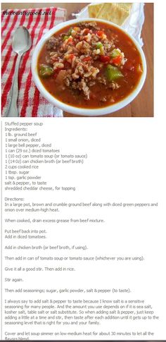 a bowl of soup with meat and vegetables in it on top of a red and white checkered table cloth