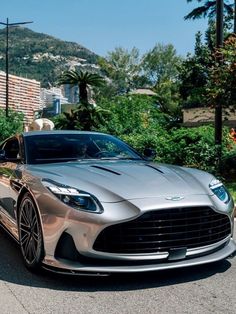 a silver car is parked on the side of the road