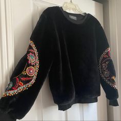 Gorgeous Embellished Sleeves. Back Fuzzy Base Sweater. Great Quality, Warm. One Size But I Believe It Fits Like A Medium Winter Black Embroidered Tops, Winter Embellished Long Sleeve Tops, Embellished Long Sleeve Tops For Winter, Black Embellished Long Sleeve Outerwear, Embellished Sleeves, Stella Marina, Embroidered Sweater, Colorful Sweaters, Black Red