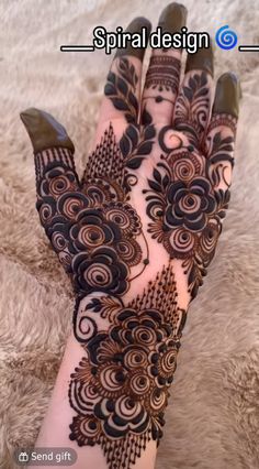 a woman's hand with henna tattoos on it and the words, spiral design