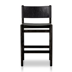 a wooden chair with black leather upholstered back and seat, on a white background