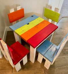 the colorful table and chairs are made out of pallet wood with different colors on them