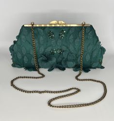 Your special occasion outfit will be complete with this elegant dark green clutch with 3-d floral beaded sequin lace.  When in doubt, request a free swatch.  Available with antique gold hardware.   Height is 5", top length is 8",  length at bottom is 11".  It expands to 2" at bottom.  Inside lining is dark green satin.    While there is a shipping cost, please know that we take the utmost care in packaging your clutch.  You will feel like you received a gift. We want you to happy with your purchase!  Our best advice is...be sure to read the product description and note the product dimensions for size so that you can make an educated purchase.  Have your color sample in hand if you are trying to match a color, and do not go by the name of the color to attempt a color match.  Keep in mind th Green Evening Bag With Chain Strap, Elegant Green Evening Bag With Chain Strap, Green Formal Clutch With Chain Strap, Formal Green Clutch With Chain Strap, Green Clutch With Chain Strap For Formal Occasions, Elegant Green Beaded Evening Bag, Green Elegant Evening Bag, Elegant Green Formal Clutch, Elegant Green Evening Bag For Event