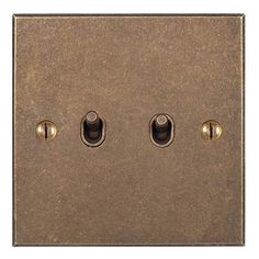 an old fashioned light switch with three knobs on the front and one in the middle