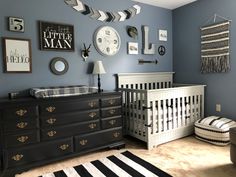 a baby's room decorated in black and white