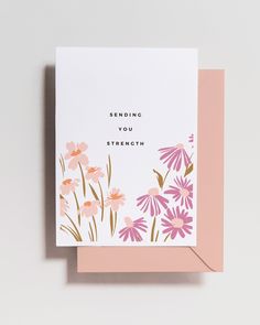 a card with pink flowers and the words sending you strength