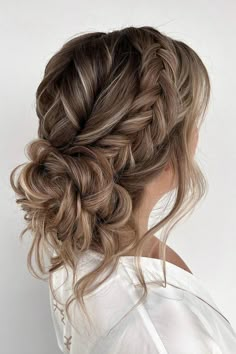 Cascading curls woven into a chic side braid, merging seamlessly into a voluminous low bun for a touch of elegance and romance. // Photo Credit: Instagram @absolutely.ineke.hairstyling Bridemaids Hairstyles Messy Bun, Bridesmaid Hair Summer Wedding, Wispy Wedding Updo, Wedding Hairstyles Boho Updo, Bridesmaid Hairstyle Braid, Loose Wedding Updos For Long Hair, Long Braid Bridal Hair, Bridesmaid Hair Long Updo, Spring Bridesmaid Hair