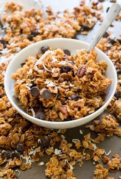 a bowl filled with granola and chocolate chips