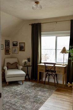 a living room filled with furniture and a window