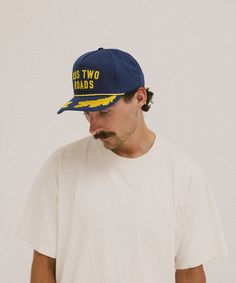 The Norfolk is made from a high quality cotton canvas. It's a tall-crowned, 5-panel trucker style ballcap that might fit you better than any other hat you've ever worn. We've been hearing that from a lot of people. Feather Hat, A Lot Of People, Dad Caps, Silver Fox, Felt Hat, Hat Band, Kids Hats, Ball Cap, Wide Brimmed