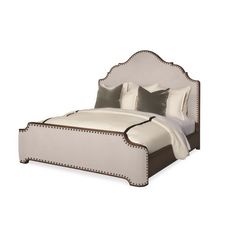 a bed with white and brown trimmings on it's headboard is shown