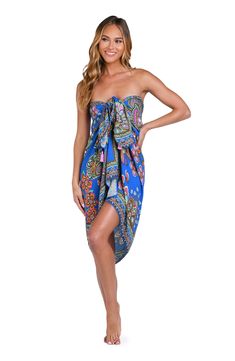 This vibrant print features a floral retro vibe, with a combination of bold and bright colors set against a bright blue background. This sarong-style pareo wrap ties at the side offering a chic silhouette, looking equally beautiful wrapped around your hips over a one-piece suit as it does bikini bottoms. [split] Details Pareo cover-up Adjustable side tie One size fits all Fabric 100% Rayon Crepe Blue Wrap Sarong For Beach, Blue Wrap Sarong For The Beach, Blue Swimwear With Bold Print For Beach, Bohemian Printed Sarong For Pool, Blue Wrap Swimwear For The Beach, Beachwear Sarong With Vibrant Print For Beach Season, Beach Season Vibrant Print Sarong, Bohemian Vibrant Print Sarong For Vacation, Bohemian Sarong With Vibrant Print For Vacation