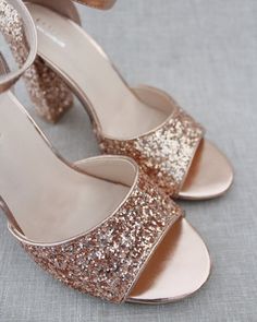 Sparkly glitter block heel sandals are perfect for date night, parties, or any special occasion.DETAILS:HEELS: 3 inchesCOLORS AVAILABLE: White, Silver, Gold, Rose Gold, Burgundy and NavyUPPER: Synthetic upper and liningMATERIALS: Mandmade outsoleORIGIN: ImportedSTYLE NAME: LAUREN Low Heel Glitter Wedding Shoes For Party, Glitter Round Toe Wedding Shoes For Party Season, Low Heel Glitter Wedding Shoes, Glamorous Block Heel Wedding Shoes For Summer, Glitter Low Heel Sandals For Prom, Prom Sandals With Round Toe For Party Season, Low Heel Glitter Sandals For Prom, Round Toe Sandals For Prom And Party Season, Wedding Sandals With Heel Strap For Party Season