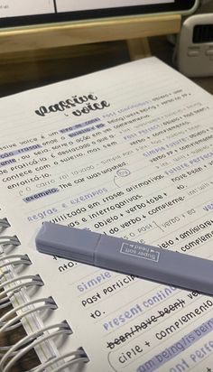 a pen sitting on top of an open notebook