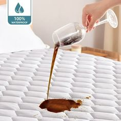 someone is pouring water into a bed that has been made to look like a mattress