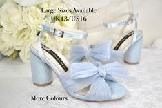 *Silk* Beautiful handmade, these shoes are perfect for any occasion. Comfortable block heel with soft silk fabric. Elegant butterfly knot bridal shoes with extra padded soles. Available in Blue or a range of other colours Design Details: * Handmade  * Comfortable with cushioned insoles. * Heel height: 8.5cm or 5cm * Colour Availability: Blue, White, Soft Pink, Black, Gold, Rose Gold, Green * Round Block Heel * Soft Silk Butterfly Knot * Open Toe Sandals Included with your order: * Handmade with Wedding Shoes Bridesmaid, Heel Protector, Blue Wedding Shoes, Something Blue Wedding, Bridal Heels, Block Heel Sandals, Bow Shoes, Womens Wedding Shoes, Hen Do