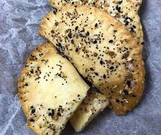 three pieces of bread with sesame seeds on top