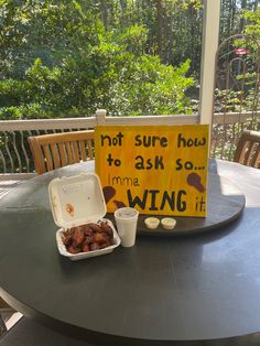 a sign on a table that says not sure how to ask so mmma wing it