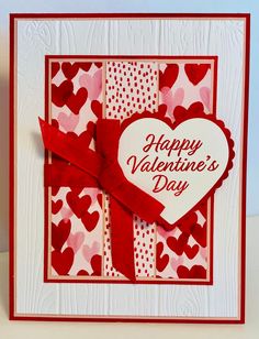 a valentine's day card with hearts on it and a red ribbon tied around the heart