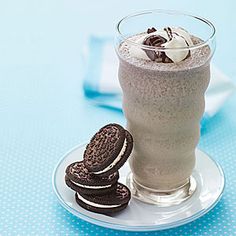 an oreo cookie and milkshake on a plate