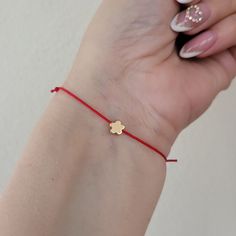 Flower bracelet, gold plated, dainty flower bracelet, charm bracelet, friendship, bff, make a wish, bridesmaids gift, Spring, adjustable Beautiful minimalist gold plated flower and string bracelet.  Mix and match with other bracelets available in our store, for an effortlessly chic look!  Also a perfect gift for your bff, your bridesmaids, or a special person in your life.  8 mm gold plated flower, moves loosely from imitate silk polyester string.  The bracelet is adjustable from 7-8 inches, it closes and opens through sliding knots.  You can adjust the bracelet by simply pulling the opposite threads.  The bracelet comes with adjustable cord in the color of your choice: Black, red, white, green, dark green,  light blue, blue, neon pink, yellow, dark red, dodger blue, indigo, colorful, pink Flower Charm Bracelet As A Gift, Minimalist Gold Plated Charm Bracelet As Gift, Rose Gold Bracelet With Flower Charm As Gift, Dainty Rose Gold Friendship Bracelets As Gift, Gold Flower Friendship Bracelet As Gift, Dainty Rose Gold Friendship Bracelet Gift, Minimalist Bracelets With Flower Charm As Gift, Handmade Flower Charm Bracelet For Gift, Handmade Flower Charm Bracelet As Gift