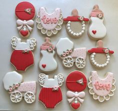 decorated cookies are arranged in the shape of baby carriages