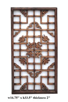 an iron screen with decorative designs on the outside, and in front of it is a white background