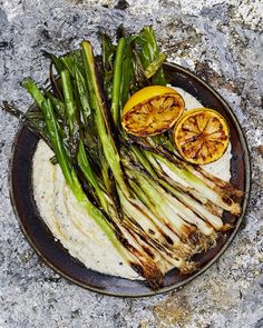 grilled asparagus and oranges on a plate