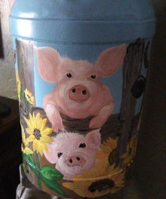 a pig painted on the side of a trash can