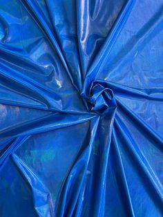 an image of blue fabric that is very shiny