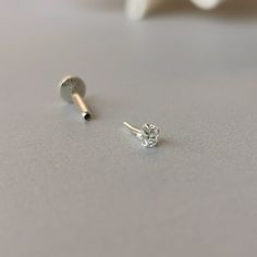 This is a set of a CZ ear piercing jewelry removable end, which has a AAA Cubic Zirconia prong setting, with a threadless push back post. RECOMMENDED WEARING POSITION EAR PIERCING - Helix, Earhead/Forward Helix - Tragus, Anti-Tragus/Surface Tragus - Cartilage/Flat - Conch, Inner Conch, Outer Conch - Lobe/Standard Lobe, Upper Lobe MATERIAL - AAA Cubic Zirconia - 925 sterling silver - 925 sterling silver threadless push back post MEASUREMENT * Removable End Size:- - CZ size : 2.5 mm, 3 mm, 4 mm * Silver Minimalist Piercings With Cubic Zirconia, Everyday Silver Cubic Zirconia Piercings, Silver Minimalist Cubic Zirconia Piercings, Tiny Minimalist Sterling Silver Piercings, Minimalist Silver Internally Threaded Piercings, Sterling Silver Piercings In Diamond White As Gift, Minimalist White Piercings For Anniversary, Tiny Cubic Zirconia Cartilage Earrings For Everyday, Everyday Internally Threaded White Gold Piercings