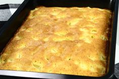 a pan filled with food sitting on top of a table