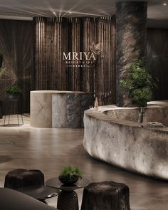 the interior of a luxury spa with large stone tubs and plant pots on tables