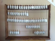 a wooden shelf with money hanging on it's sides in front of a stair case