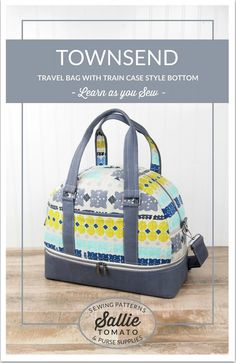 the travel bag with train case style bottom is shown in blue, yellow and white