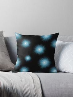 a black background with blue fireworks throw pillow